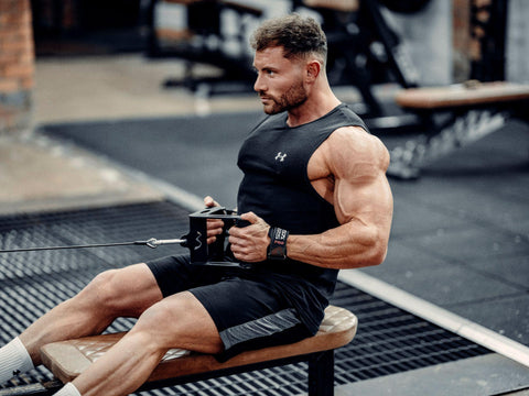 Male in the gym using Versa Gripps during a workout