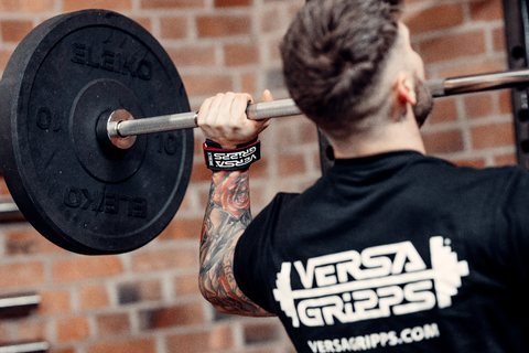 Versa Gripps Xtreme series being used to assist a male weightlifter in the gym
